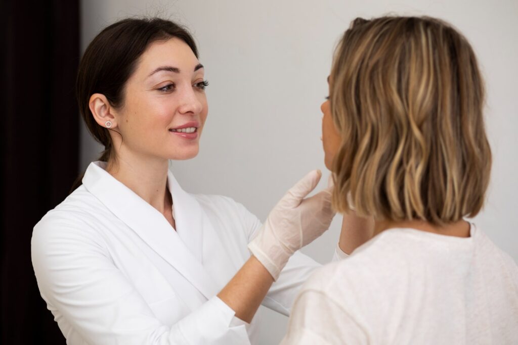 A dermatologist consulting with a client, emphasizing the importance of individualized care in modern skincare.